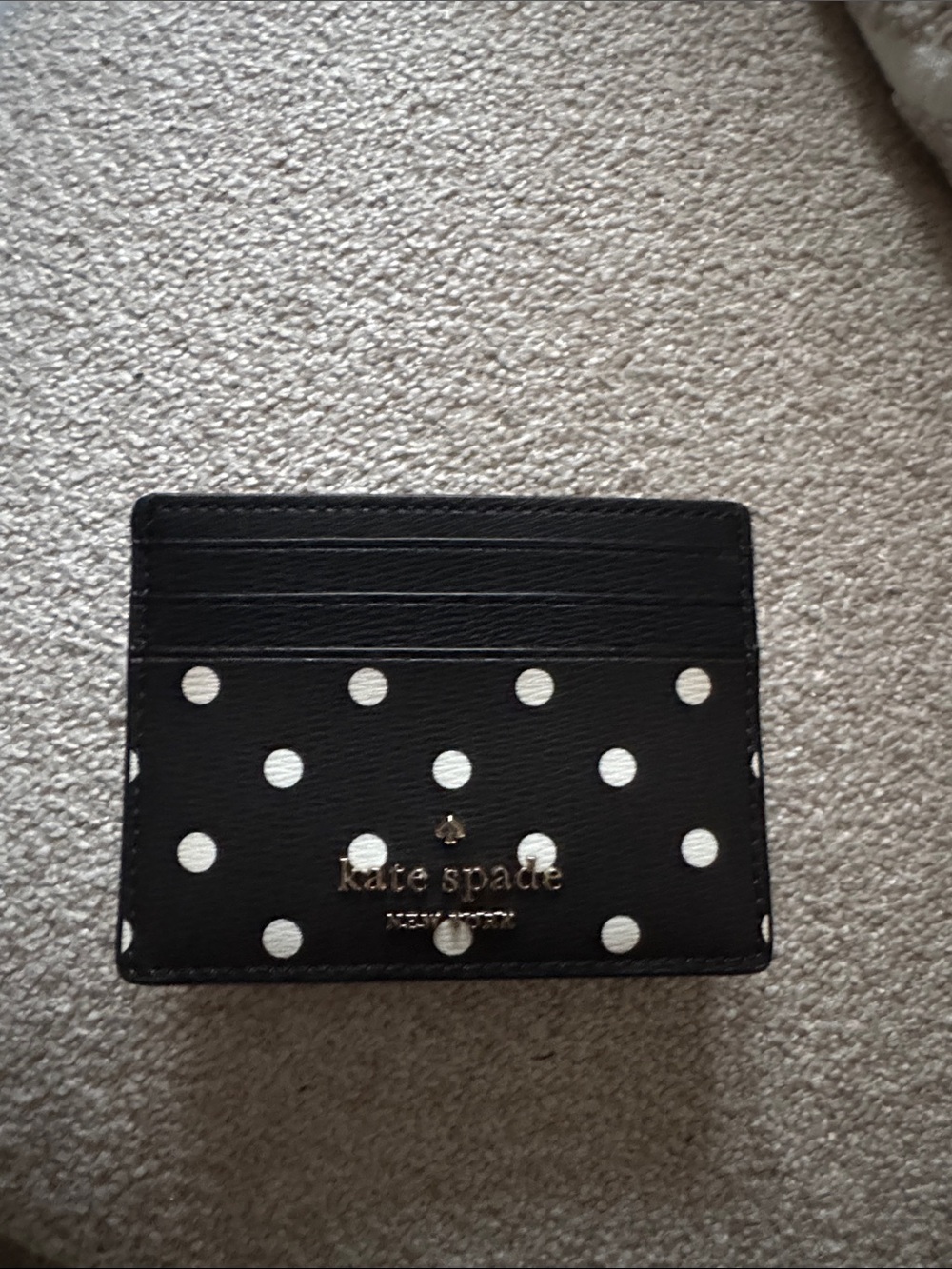 kate spade black card holder with white polka dots